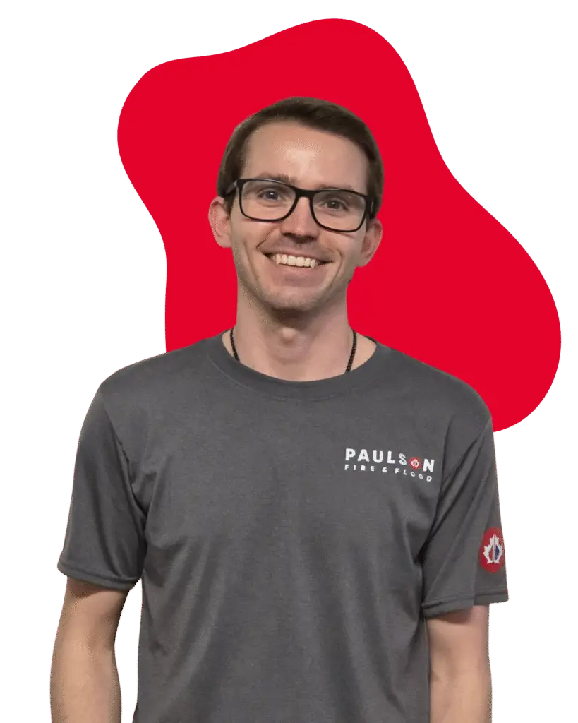 Jordan Dawe, Associate Project Manager at Paulson Fire and Flood, standing in downtown Cranbrook, BC