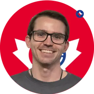 Jordan Dawe, Project Manager, smiling in a black jacket against a branded red and white background